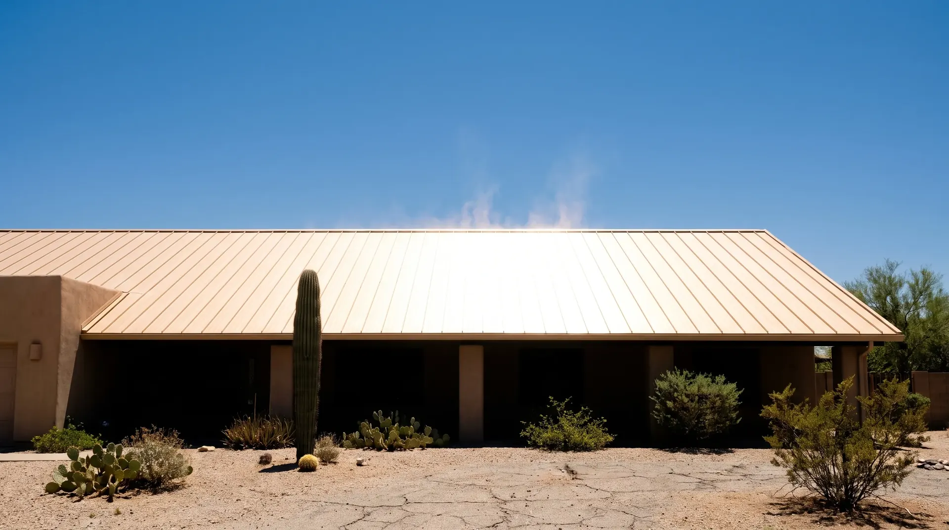 Hard midday desert sun striking a light coloured metal roof on a Tucson home